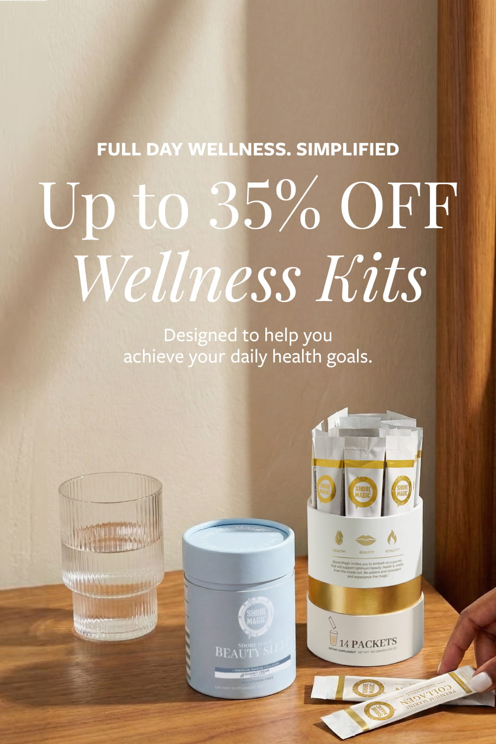 Woman reaching over Shore Magic AM and PM Ritual Kit featuring collagen stick packs and Beauty Sleep on a wooden nightstand next to a glass of water 