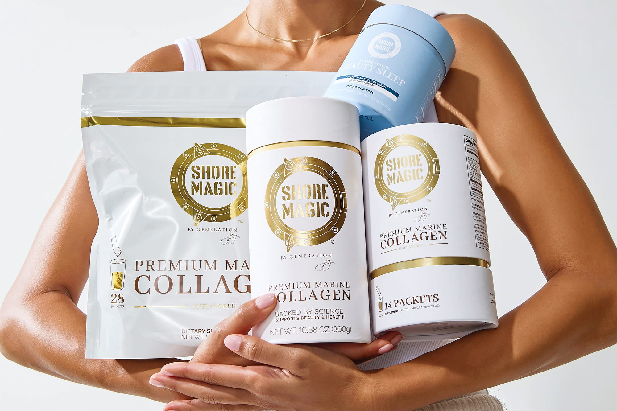 Woman holding Shore Magic products: Shore Magic Pouches and Canisters